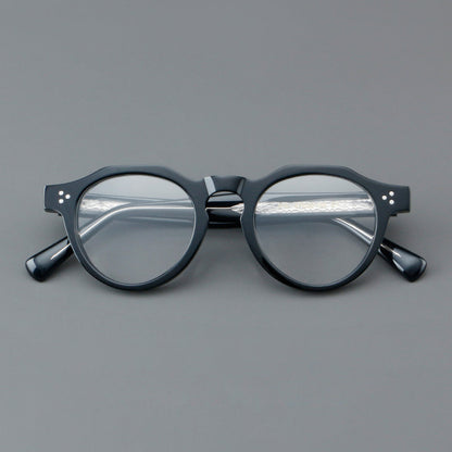 
Monturas de gafas redondas retro de acetato con puente de cerradura elevado y remaches en las esquinas