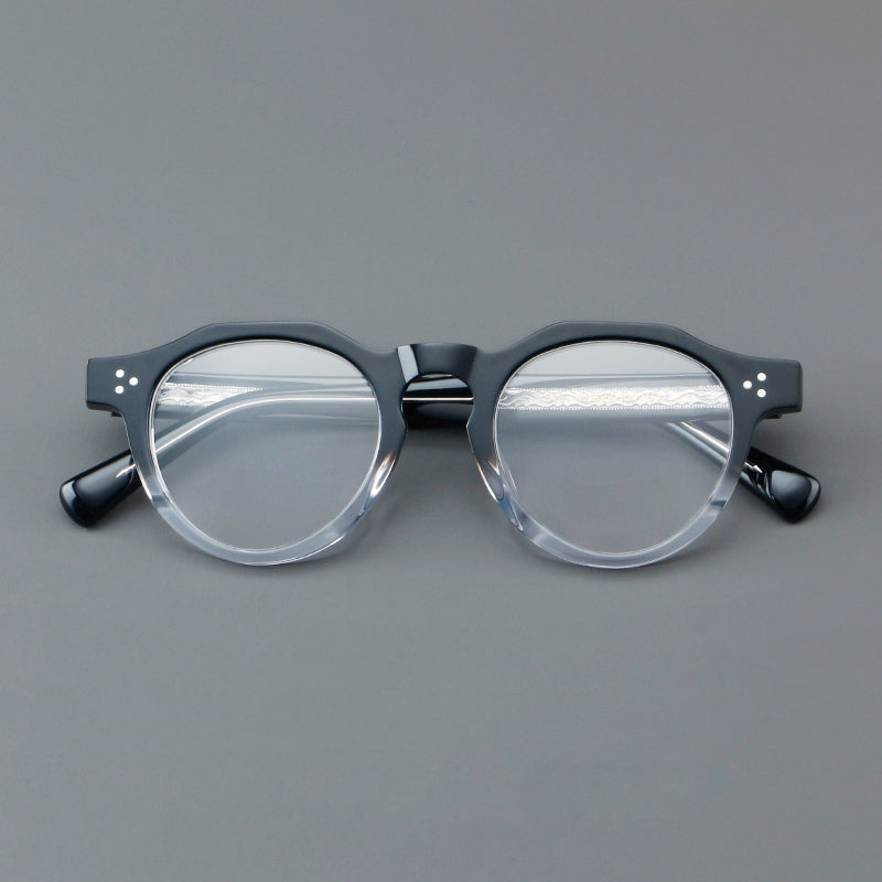 
Monturas de gafas redondas retro de acetato con puente de cerradura elevado y remaches en las esquinas - Negro y Transparente
