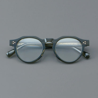 
Monturas de gafas redondas retro de acetato con puente de cerradura elevado y remaches en las esquinas - Imagen 4