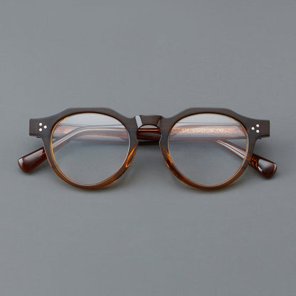 
Monturas de gafas redondas retro de acetato con puente de cerradura elevado y remaches en las esquinas - Imagen 5