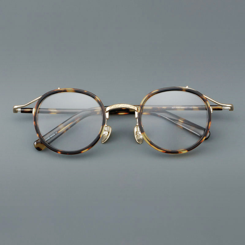 
Montura de gafas redondas retro de acetato con puente de metal fino y detalles laterales - Imagen 2