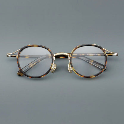 
Montura de gafas redondas retro de acetato con puente de metal fino y detalles laterales - Imagen 2