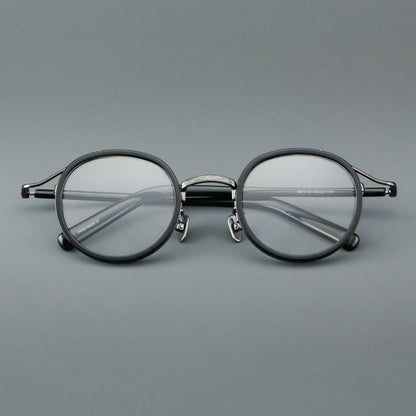 
Montura de gafas redondas retro de acetato con puente de metal fino y detalles laterales - Imagen 9