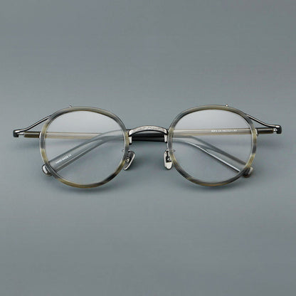 
Montura de gafas redondas retro de acetato con puente de metal fino y detalles laterales - Imagen 10