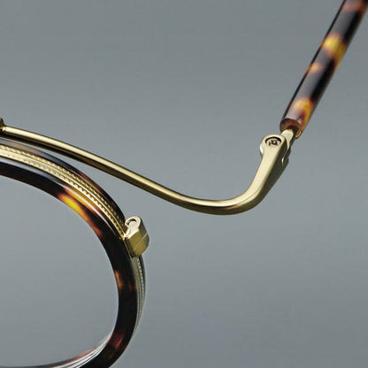 
Montura de gafas redondas retro de acetato con puente de metal fino y detalles laterales - Imagen 11