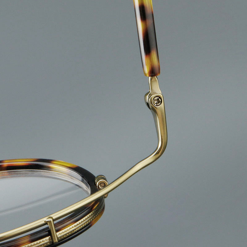 
Montura de gafas redondas retro de acetato con puente de metal fino y detalles laterales