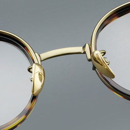 
Montura de gafas redondas retro de acetato con puente de metal fino y detalles laterales - Imagen 13