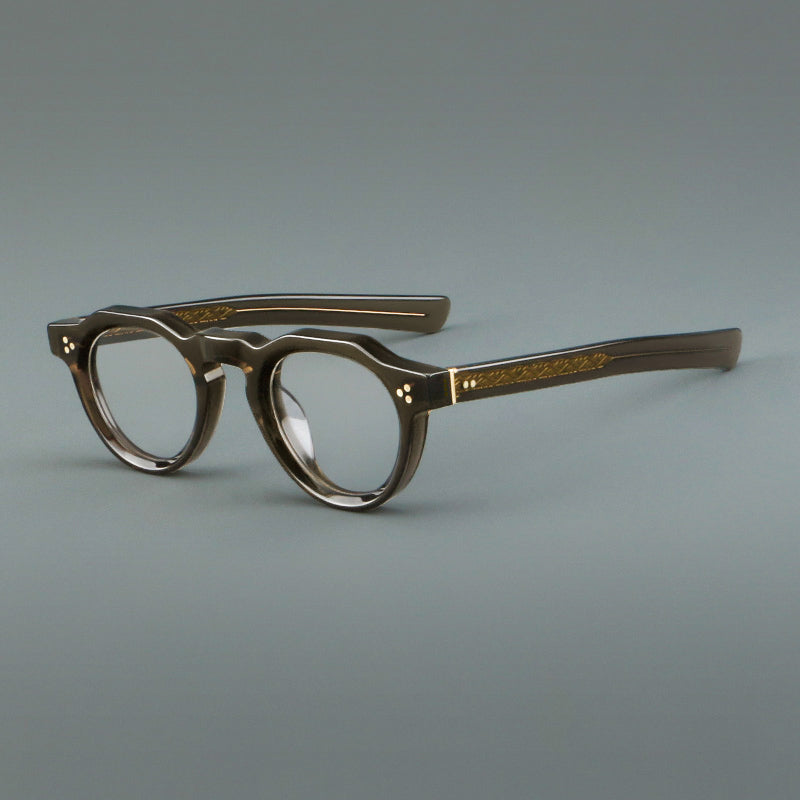 
Monturas de gafas vintage de acetato con forma geométrica, borde superior facetado y puente de cerradura