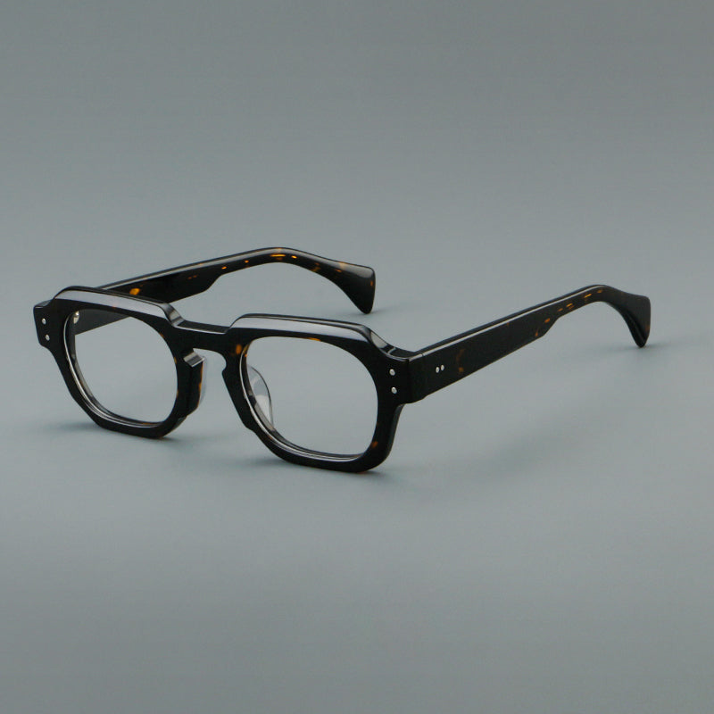 
Monturas de gafas retro cuadradas de acetato con bordes gruesos esculpidos y remaches en las esquinas
