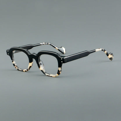 
Monturas de gafas geométricas cuadradas de acetato con línea superior escalonada y detalles de remaches