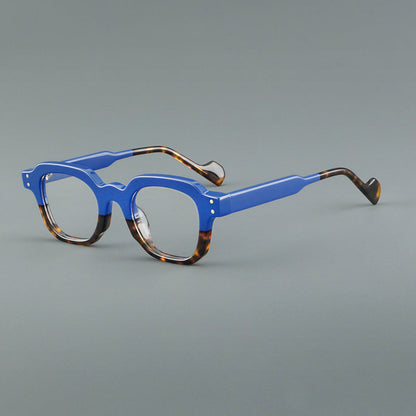 
Monturas de gafas geométricas cuadradas de acetato con línea superior escalonada y detalles de remaches - Imagen 6