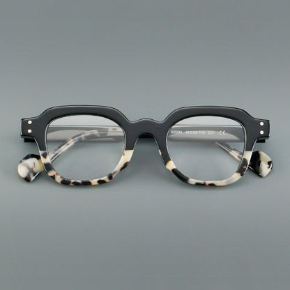 
Monturas de gafas geométricas cuadradas de acetato con línea superior escalonada y detalles de remaches - Imagen 9