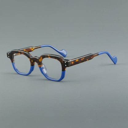 
Monturas de gafas geométricas cuadradas de acetato con línea superior escalonada y detalles de remaches - Imagen 10