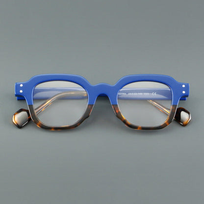 
Monturas de gafas geométricas cuadradas de acetato con línea superior escalonada y detalles de remaches - Imagen 11