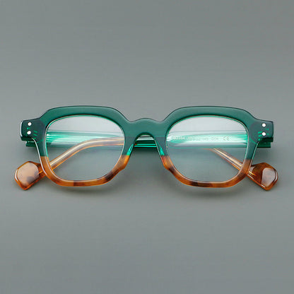 
Monturas de gafas geométricas cuadradas de acetato con línea superior escalonada y detalles de remaches - Imagen 13