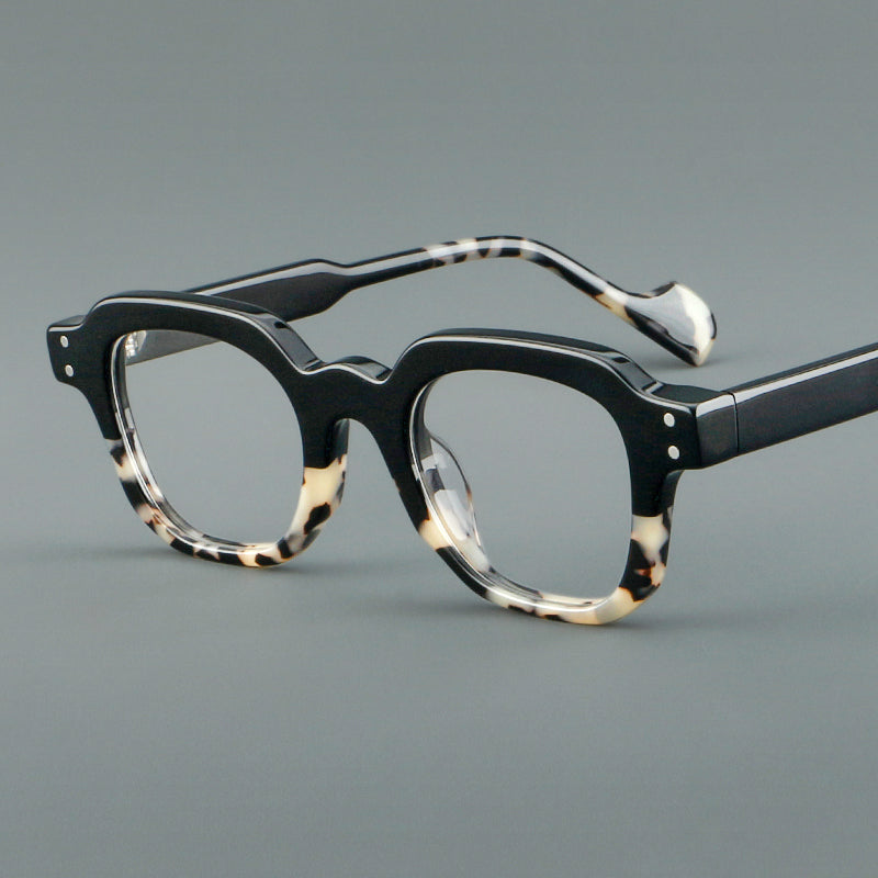 
Monturas de gafas geométricas cuadradas de acetato con línea superior escalonada y detalles de remaches - Imagen 14