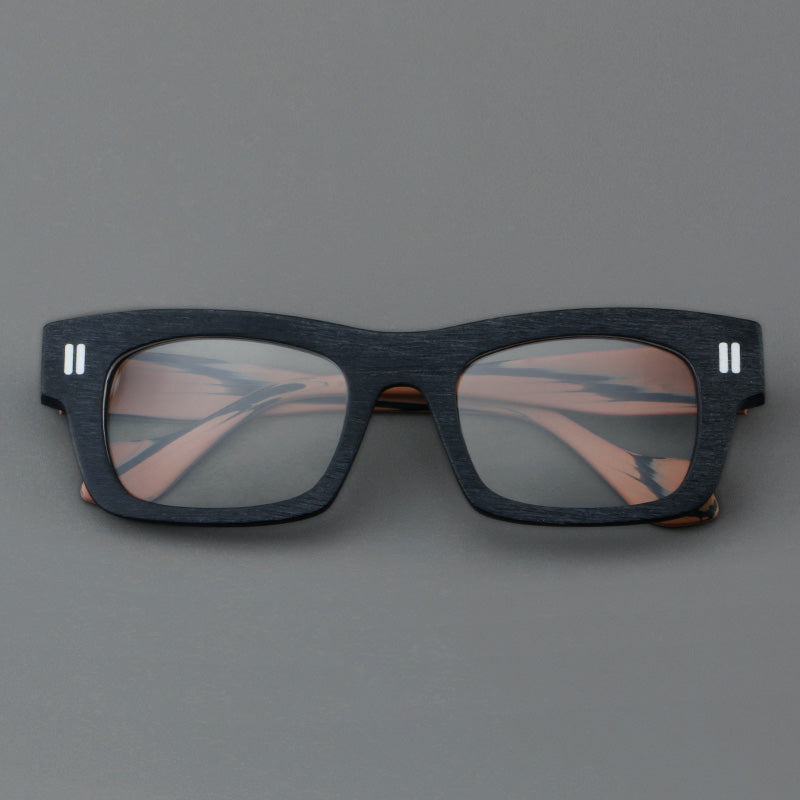 
Monturas de gafas retro rectangulares de acetato con cejas gruesas y detalles de doble barra en las esquinas