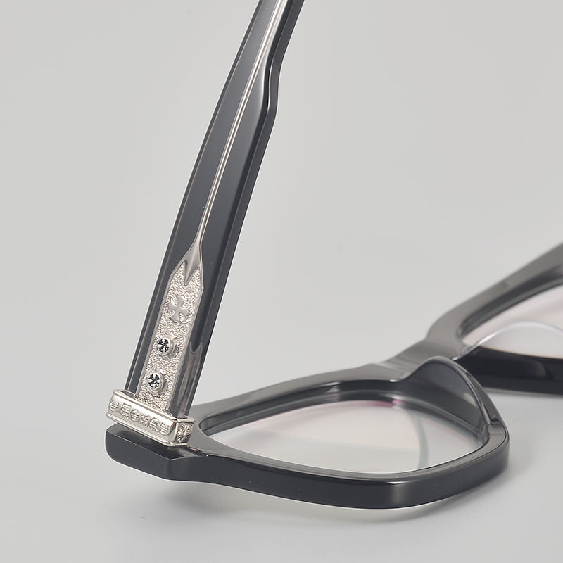 
Monturas de gafas rectangulares de acetato y titanio con esquinas redondeadas y detalles estampados en las varillas - Imagen 5