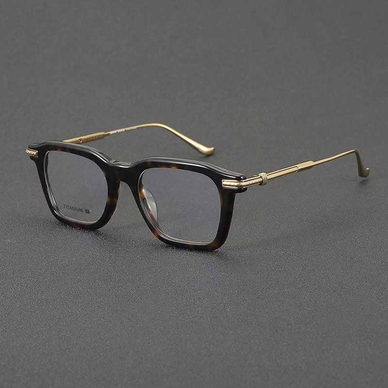 
Monturas de gafas rectangulares retro con línea superior definida y patillas de metal delgadas