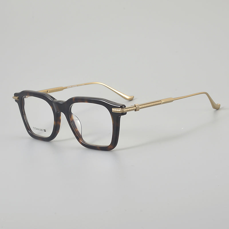 
Monturas de gafas rectangulares retro con línea superior definida y patillas de metal delgadas