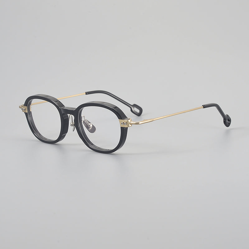 
Monturas de gafas redondas retro de aleación de titanio con línea de cejas curva y detalles laterales de metal