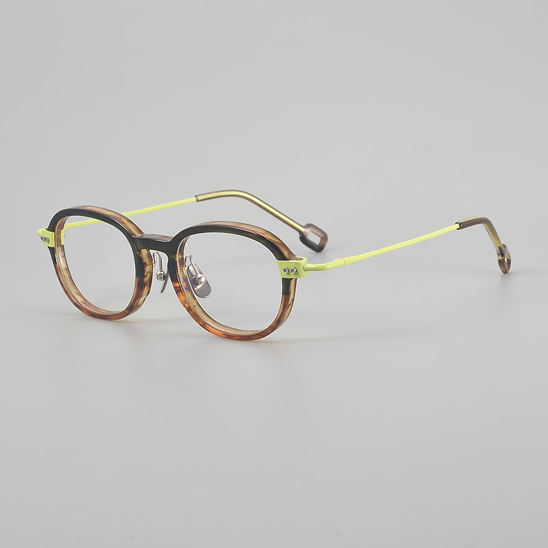 
Monturas de gafas redondas retro de aleación de titanio con línea de cejas curva y detalles laterales de metal