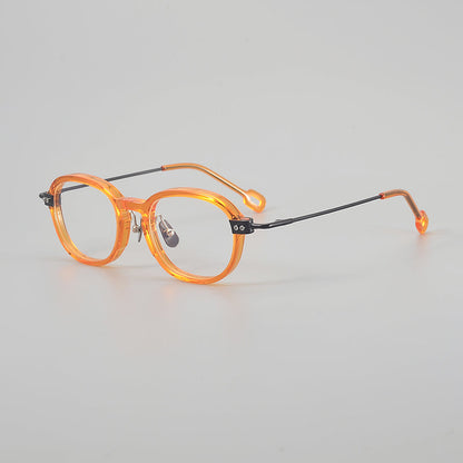 
Monturas de gafas redondas retro de aleación de titanio con línea de cejas curva y detalles laterales de metal - Imagen 8