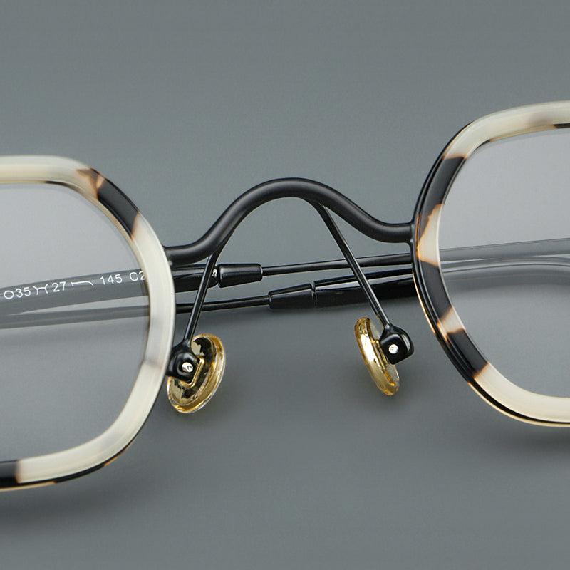 
Monturas de gafas redondas geométricas vintage con puente arqueado elevado y almohadillas nasales