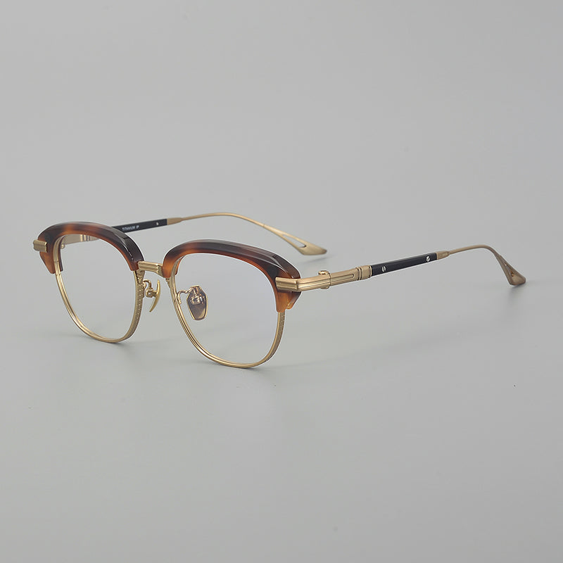 
Monturas de gafas retro Browline de titanio con aros rectangulares redondeados y marco inferior de metal