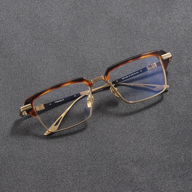 
Monturas de gafas rectangulares vintage de titanio con línea superior definida y bordes inferiores de metal fino
