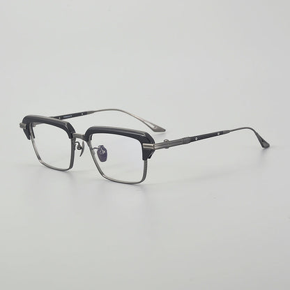 
Monturas de gafas rectangulares vintage de titanio con línea superior definida y bordes inferiores de metal fino