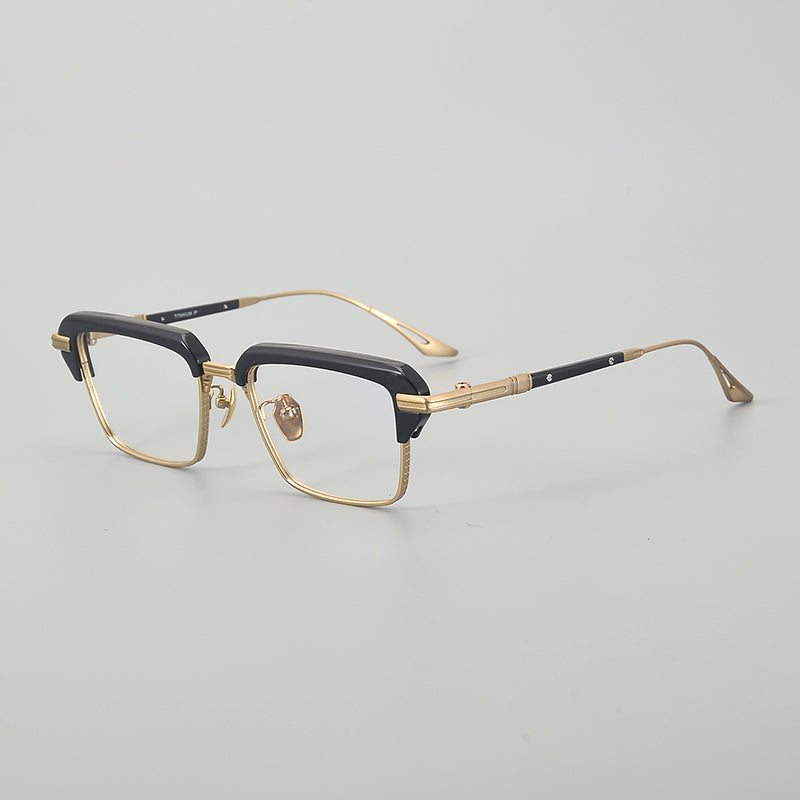 
Monturas de gafas rectangulares vintage de titanio con línea superior definida y bordes inferiores de metal fino - Negro y dorado