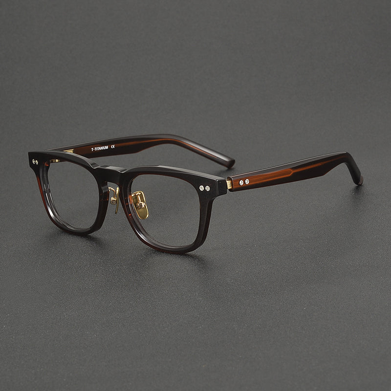 
Monturas de gafas clásicas cuadradas de acetato con detalle de remaches en el frente y varillas anchas