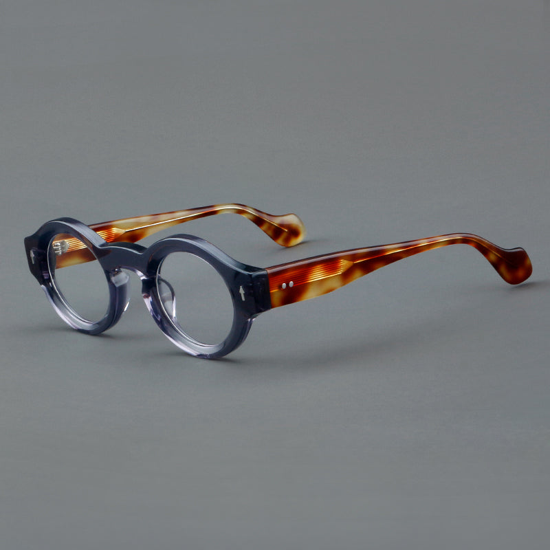 
Monturas de gafas retro redondas de acetato, bordes circulares gruesos y detalles laterales esculpidos
