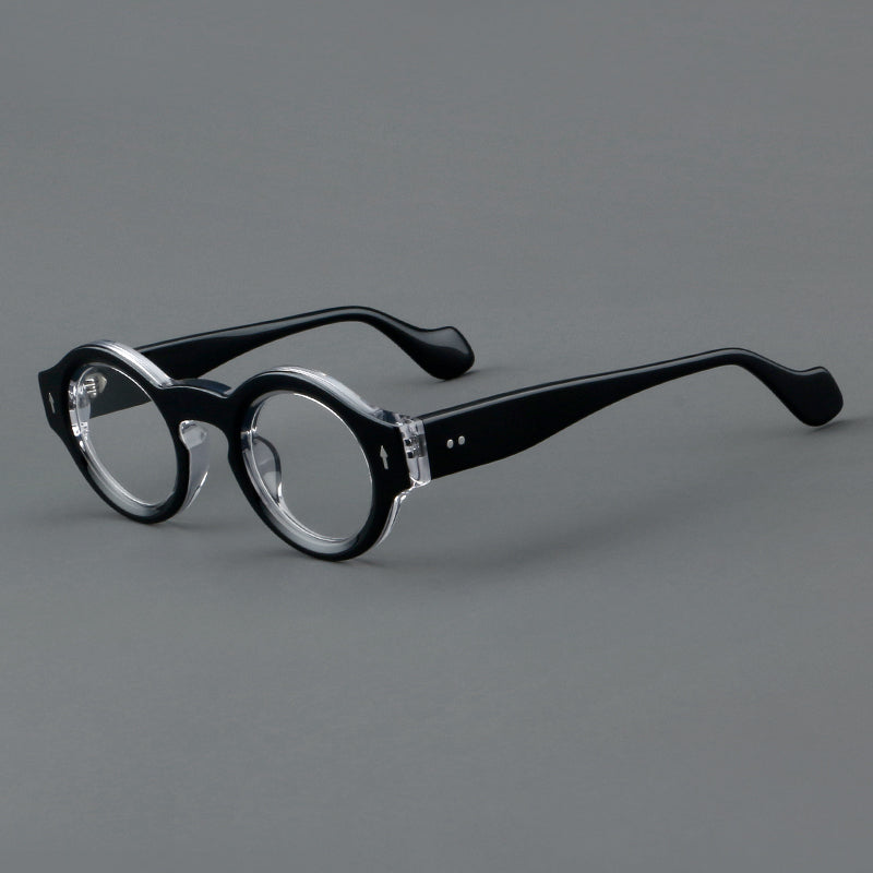 
Monturas de gafas retro redondas de acetato, bordes circulares gruesos y detalles laterales esculpidos - Negro y Transparente