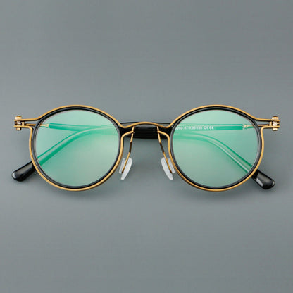 
Monturas de gafas redondas vintage con diseño de borde superpuesto y detalle de puente metálico - Imagen 2