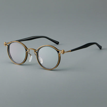 
Monturas de gafas redondas vintage con diseño de borde superpuesto y detalle de puente metálico