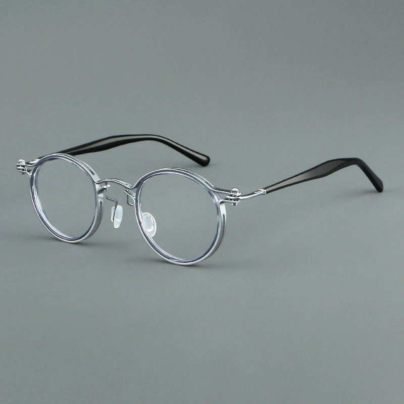 
Monturas de gafas redondas vintage con diseño de borde superpuesto y detalle de puente metálico