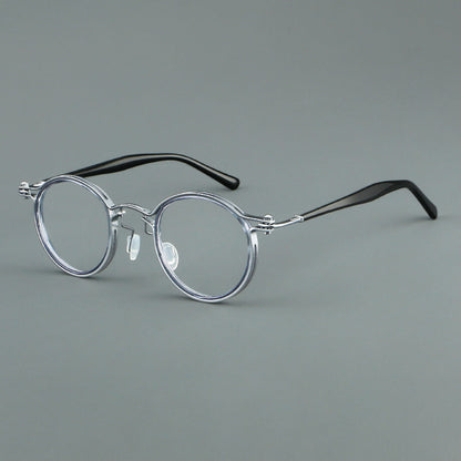 
Monturas de gafas redondas vintage con diseño de borde superpuesto y detalle de puente metálico - Imagen 7