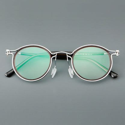 
Monturas de gafas redondas vintage con diseño de borde superpuesto y detalle de puente metálico - Imagen 10