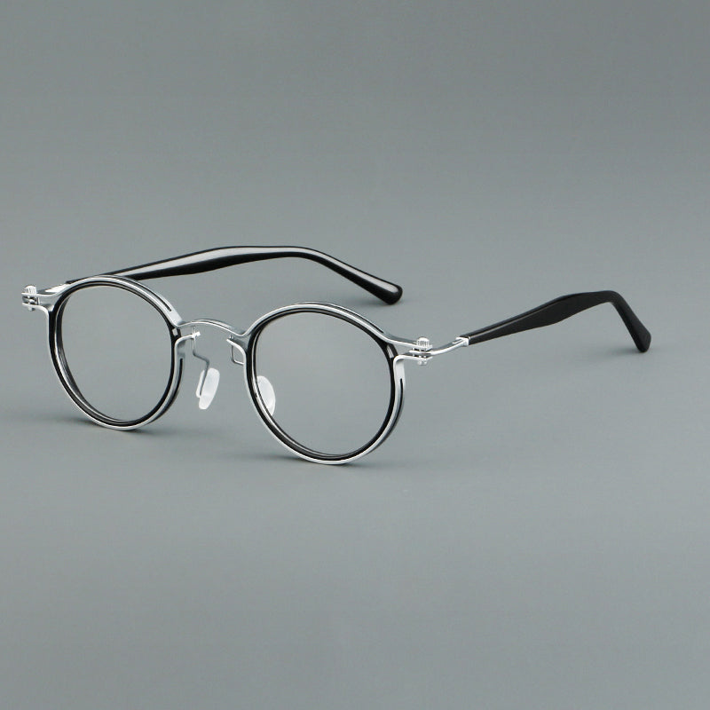 
Monturas de gafas redondas vintage con diseño de borde superpuesto y detalle de puente metálico