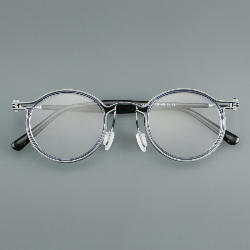 
Monturas de gafas redondas vintage con diseño de borde superpuesto y detalle de puente metálico