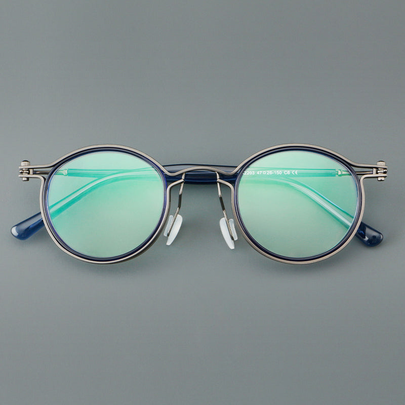 
Monturas de gafas redondas vintage con diseño de borde superpuesto y detalle de puente metálico