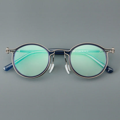 
Monturas de gafas redondas vintage con diseño de borde superpuesto y detalle de puente metálico - Imagen 13