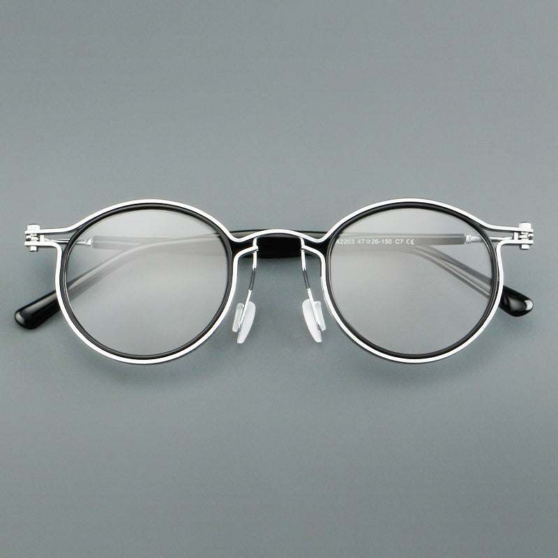 
Monturas de gafas redondas vintage con diseño de borde superpuesto y detalle de puente metálico