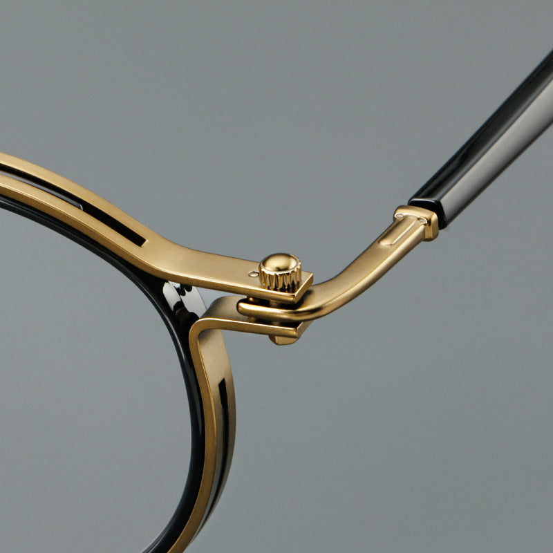 
Monturas de gafas redondas vintage con diseño de borde superpuesto y detalle de puente metálico