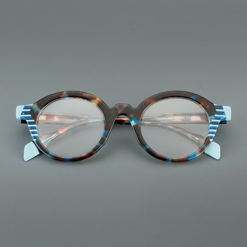
Monturas de gafas redondas decorativas de acetato con detalles a rayas en las esquinas y varillas esculpidas