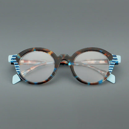 
Monturas de gafas redondas decorativas de acetato con detalles a rayas en las esquinas y varillas esculpidas - Imagen 2