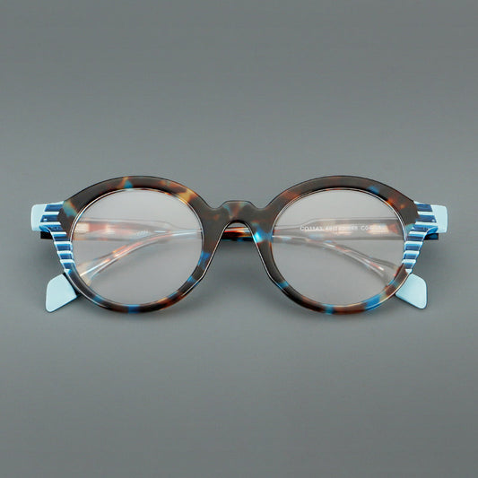 Monturas de gafas redondas decorativas de acetato con detalles a rayas en las esquinas y varillas esculpidas