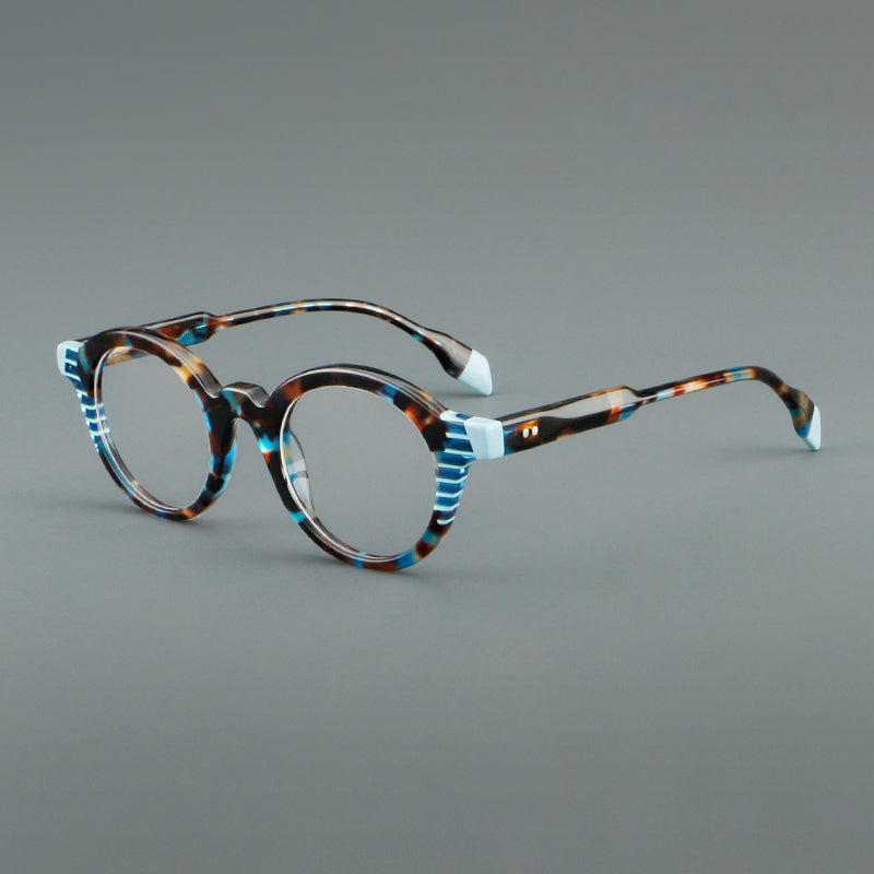 
Monturas de gafas redondas decorativas de acetato con detalles a rayas en las esquinas y varillas esculpidas